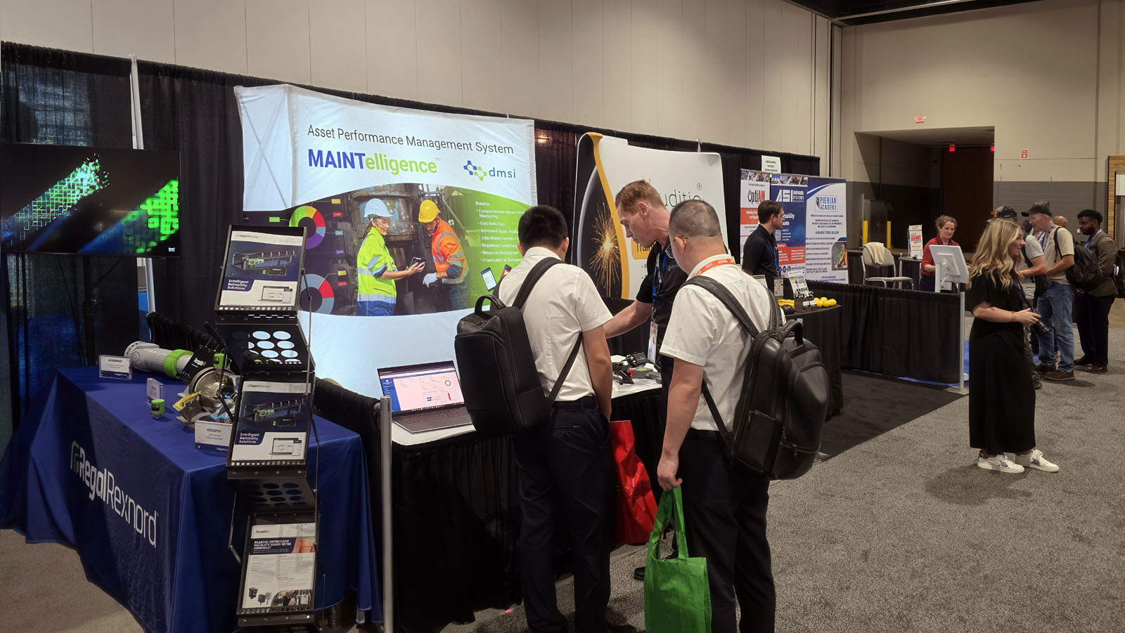 Our booth at Reliable Plant Conference with John talking to our lovely guests.