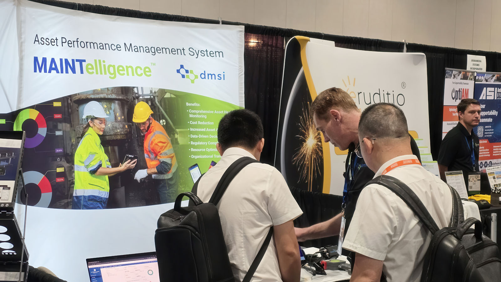 Our booth at Reliable Plant Conference with John talking to our lovely guests.