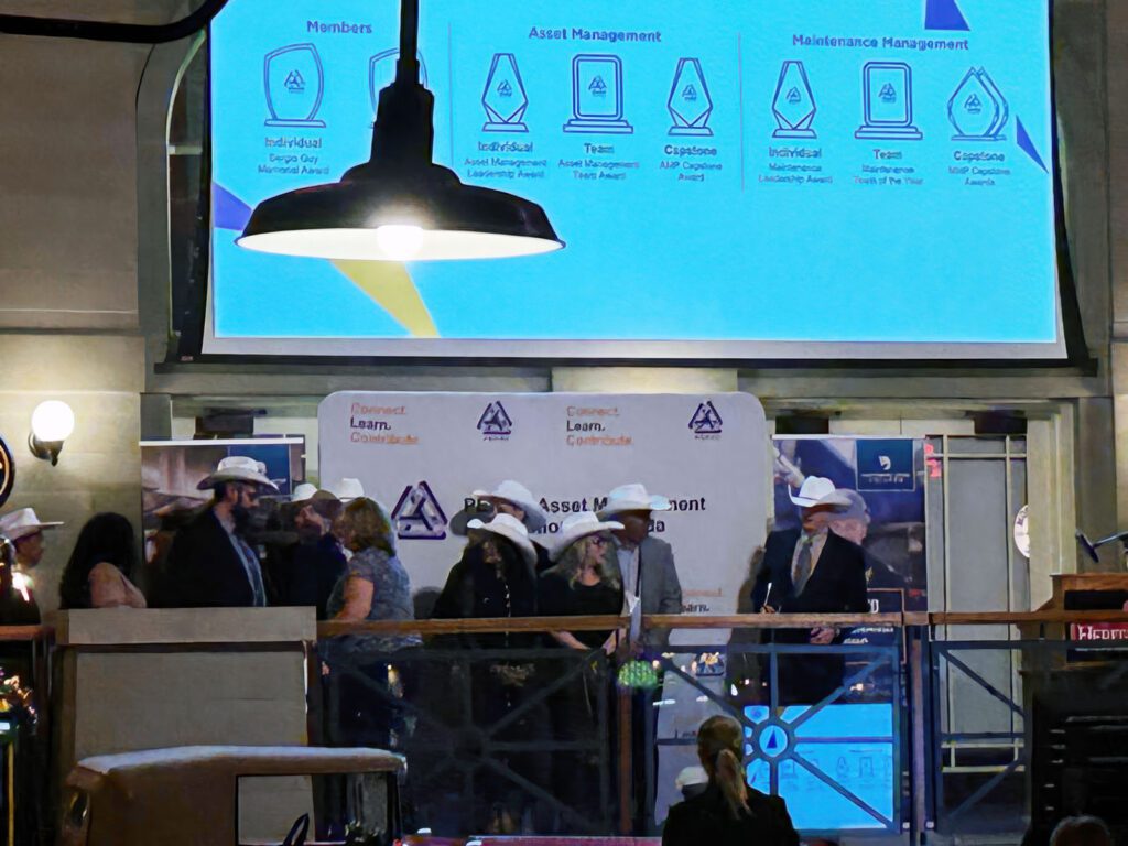 Maintenance and Reliability professionals being awarded on stage at MainTrain 2025.