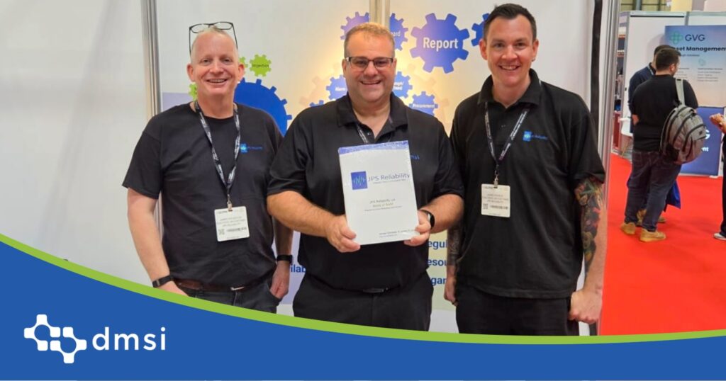 Andrew from DMSI presents an award to James Sylvester and James Pearce of JPS Reliability at the Asset Performance Management System trade show booth.