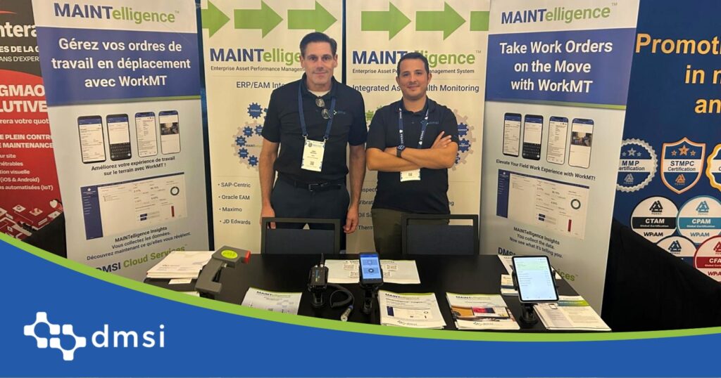 John MacSween and Ilyass of DMSI behind MainTrain 2026 booth table, showing MAINTelligence™ brochures, handheld inspection devices and bilingual banners